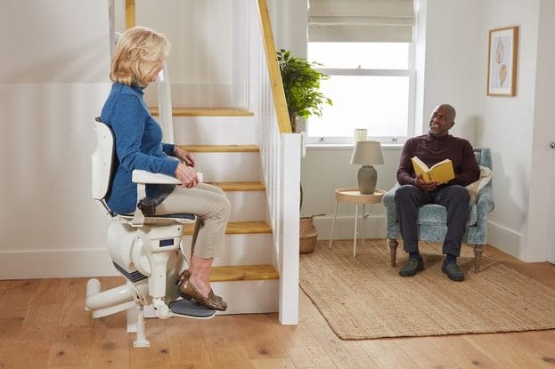 ULTIMATE Lift with Lady in transit man in armchair 2
