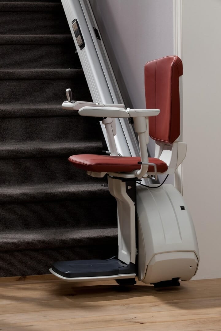 homeglide extra stairlift traditional set side view parked at bottom 1